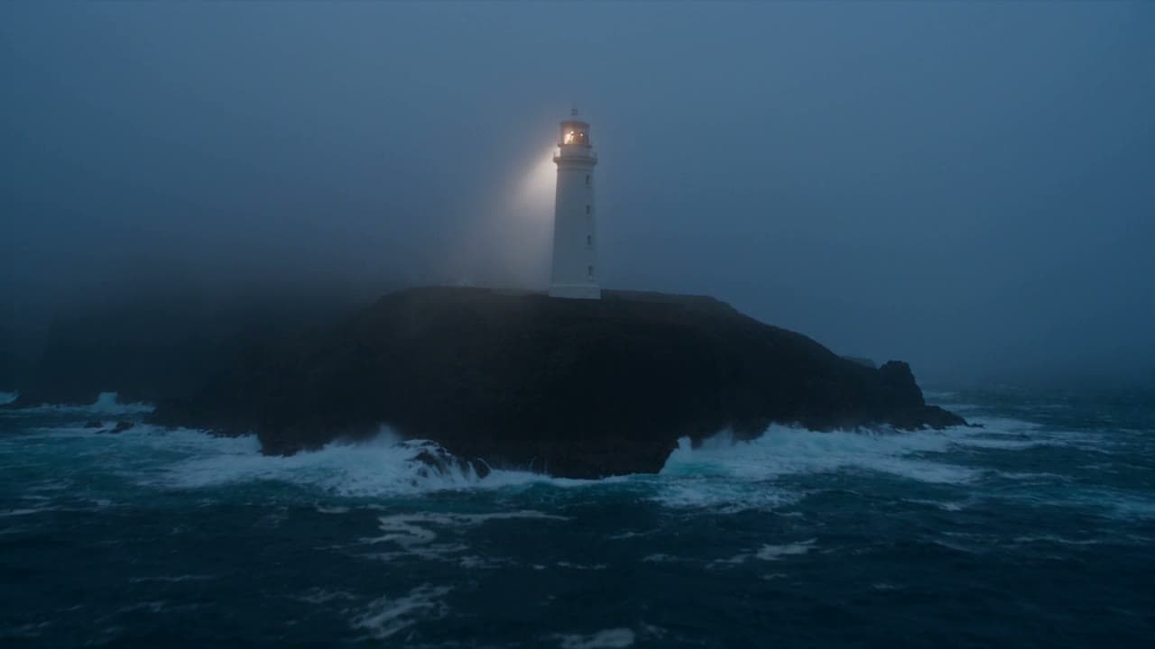 A white lighthouse on a rocky island at dusk, its beam cutting through fog above heavy surf, rendered on the Premium engine